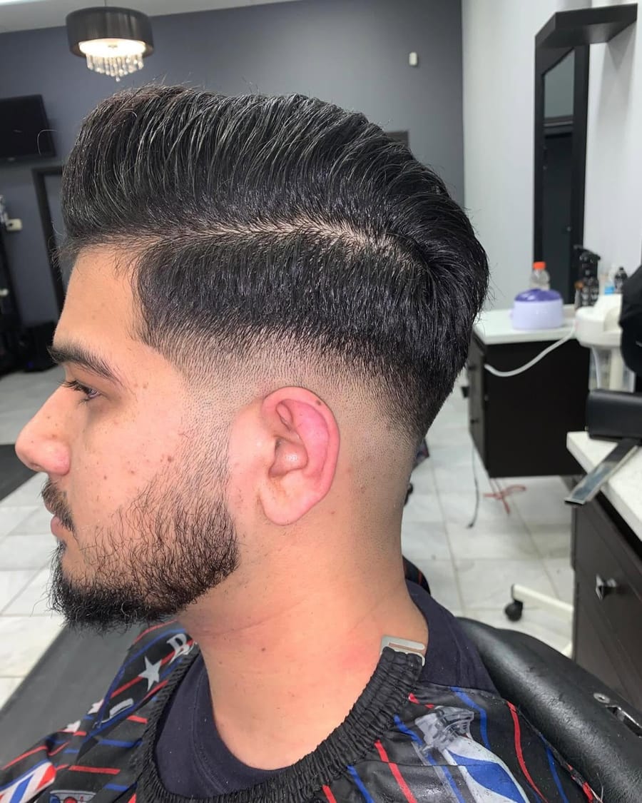 Finished taper fade and pompadour haircut, side profile